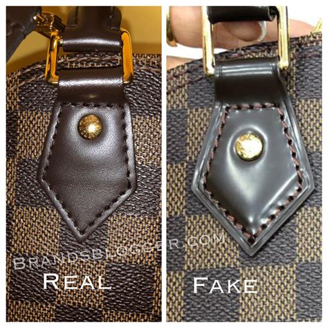 how do you tell fake louis vuitton alma bag